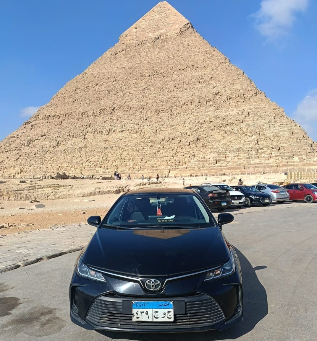 A Zway Co Toyota Corolla in front of the Giza pyramids